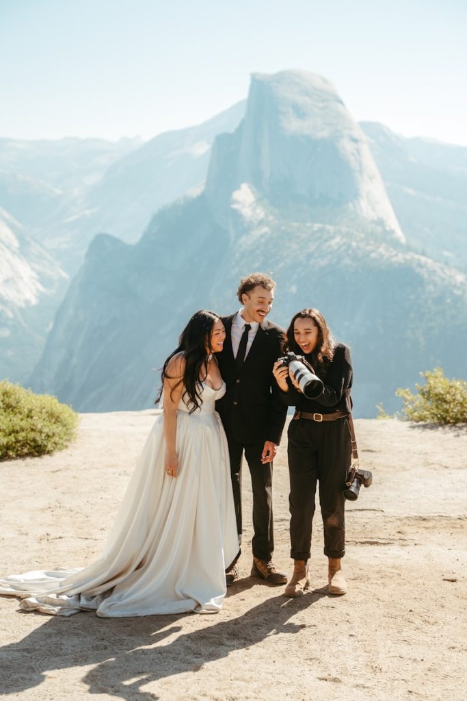 Couple with photographer at scenic overlook